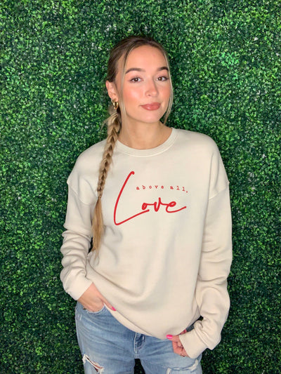 Above All, Love Graphic Sweatshirt by Oat and Collective