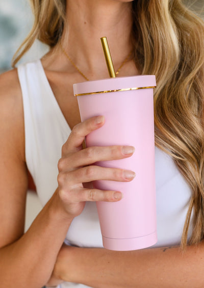 Pink and gold tumbler for drinking